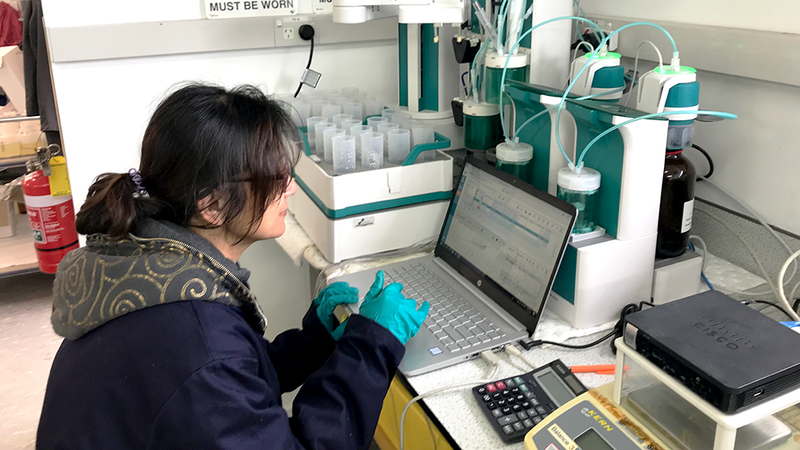 Ventia employee working on a laptop in the lab